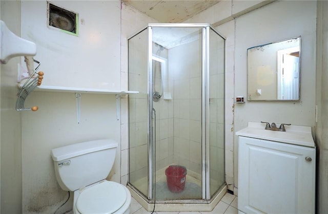 bathroom featuring vanity, an enclosed shower, and toilet