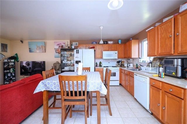 kitchen with sink, white appliances, backsplash, and light tile patterned flooring