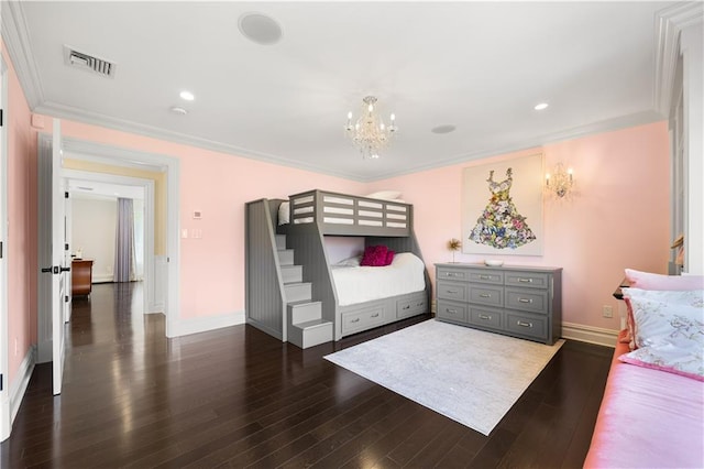 bedroom with dark wood finished floors, visible vents, ornamental molding, a chandelier, and baseboards