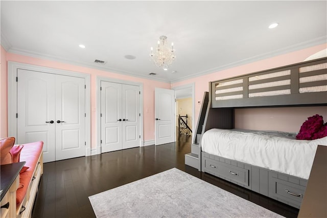 bedroom with dark wood-style flooring, recessed lighting, visible vents, and crown molding