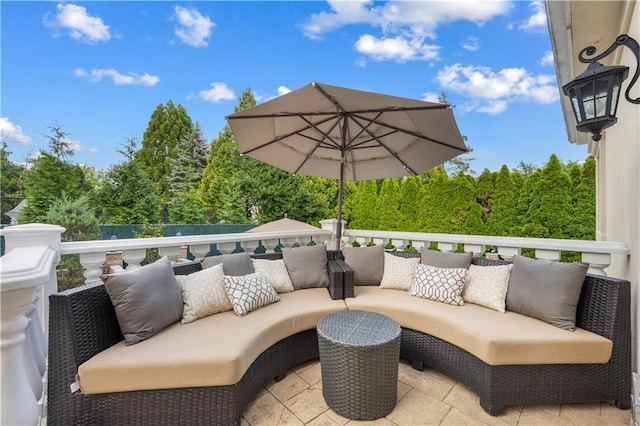 view of patio with an outdoor hangout area and a balcony