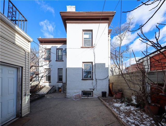 rear view of house featuring a patio