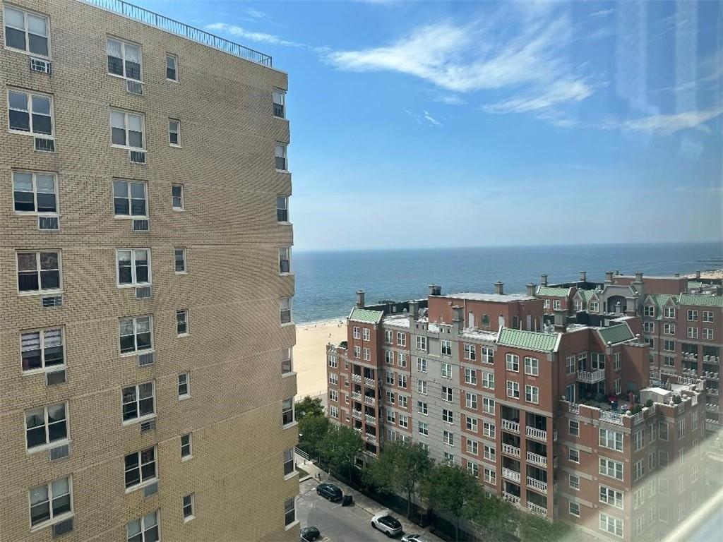 view of building exterior with a water view