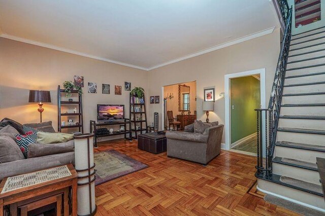 living room with light parquet flooring and crown molding