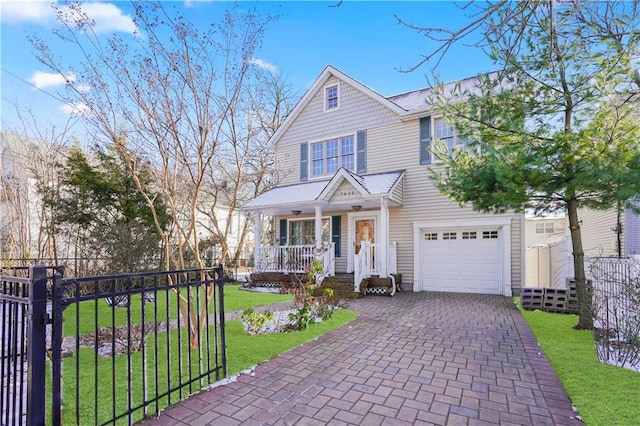 view of front of house with a porch, a garage, and a front lawn