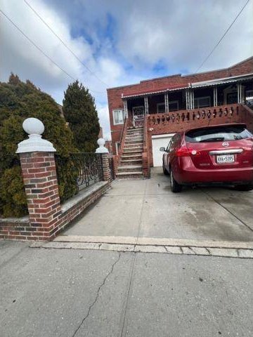 1241 E 98th St, Brooklyn, NY 11236 - view of front facade with stairway and driveway