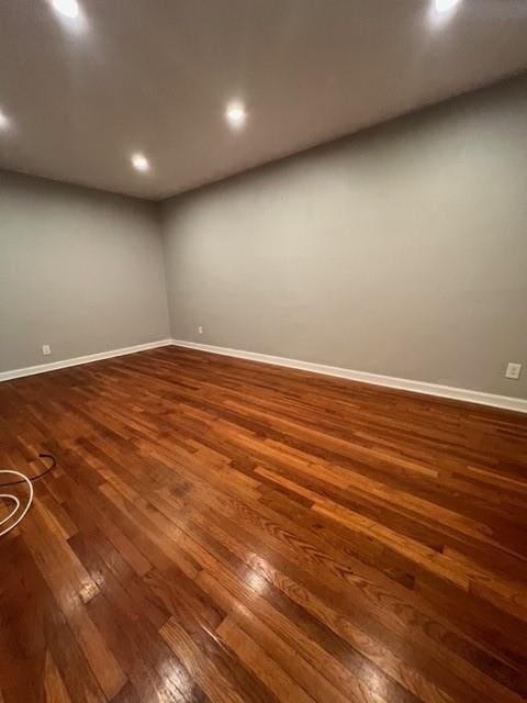 1241 E 98th St, Brooklyn, NY 11236 - spare room with dark wood-type flooring, baseboards, and recessed lighting