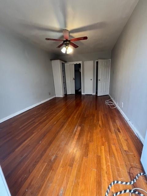 1241 E 98th St, Brooklyn, NY 11236 - unfurnished bedroom featuring hardwood / wood-style flooring, baseboards, and a ceiling fan
