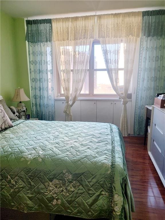 bedroom featuring wood finished floors