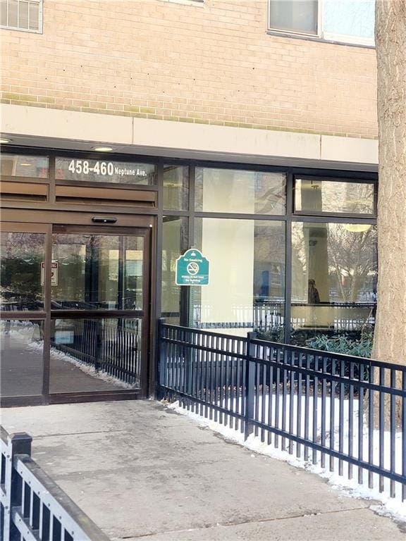 entrance to property with brick siding