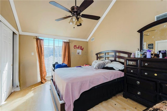 bedroom featuring access to exterior, visible vents, vaulted ceiling, ornamental molding, and light wood-style flooring