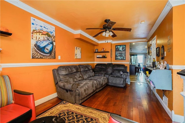 living room featuring hardwood / wood-style flooring, ornamental molding, a ceiling fan, and baseboards