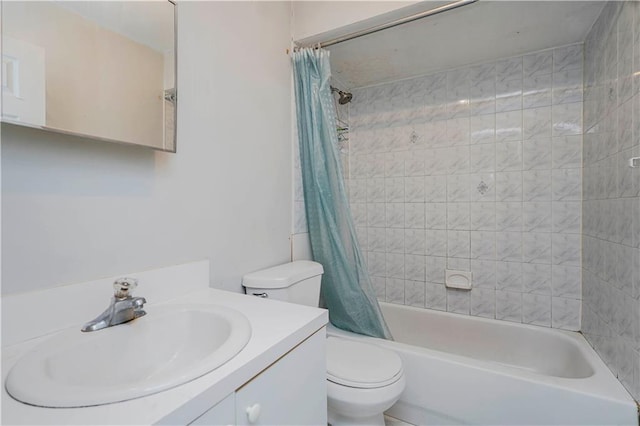bathroom featuring vanity, toilet, and shower / bath combination with curtain