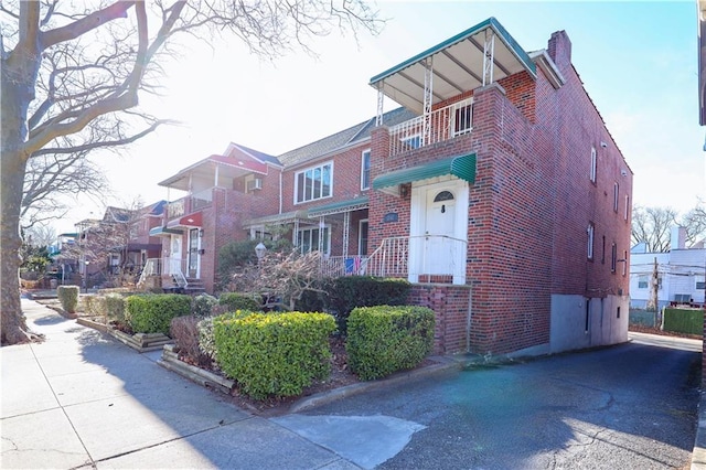 view of front of home with a balcony