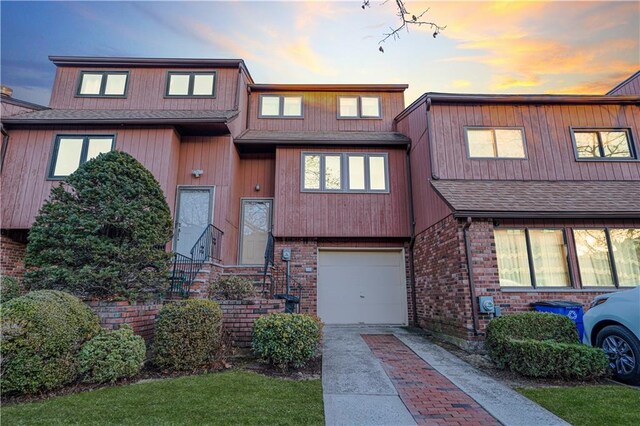 townhome / multi-family property featuring a garage