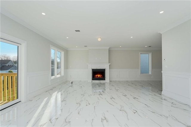 unfurnished living room with ornamental molding