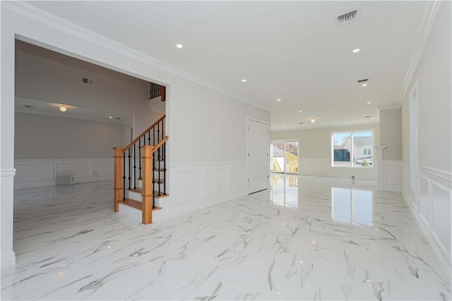 spare room with crown molding