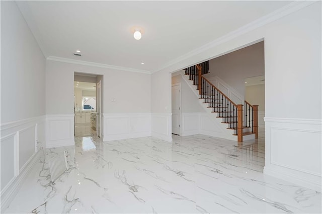 spare room featuring crown molding