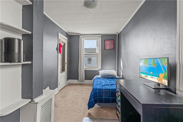 bedroom with light carpet and ornamental molding