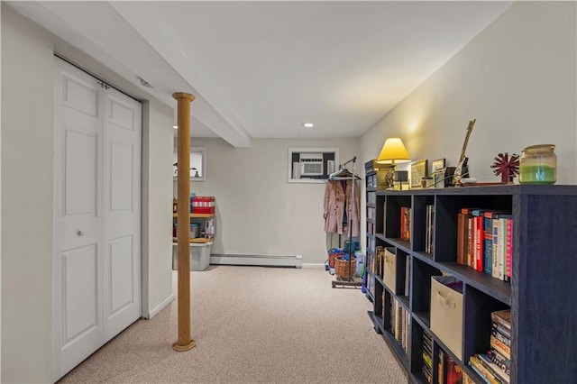 interior space featuring carpet floors, baseboard heating, and a wall mounted AC