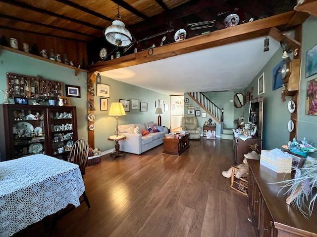 bedroom with wood ceiling, lofted ceiling with beams, and wood finished floors