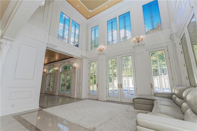 sunroom / solarium featuring a wealth of natural light and french doors