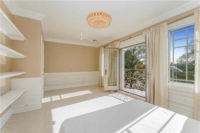 unfurnished bedroom featuring a decorative wall, tile patterned floors, wainscoting, access to exterior, and crown molding