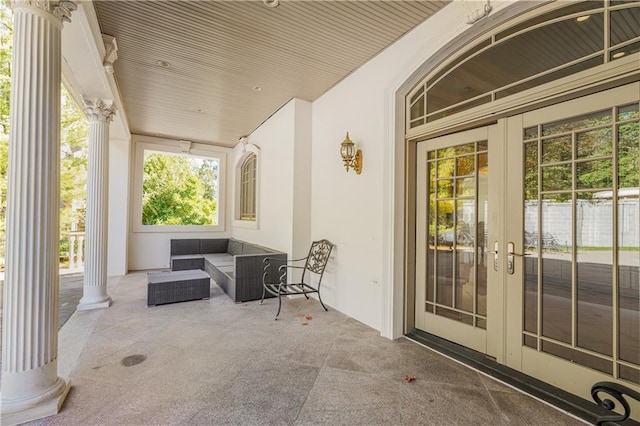 view of patio / terrace with outdoor lounge area, covered porch, and french doors