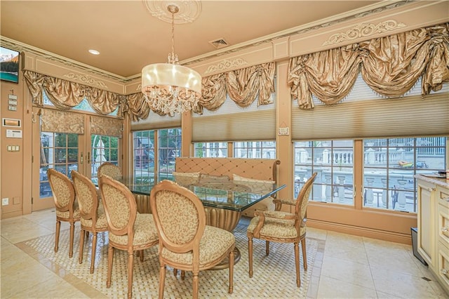 tiled dining area with french doors, ornamental molding, plenty of natural light, and a chandelier