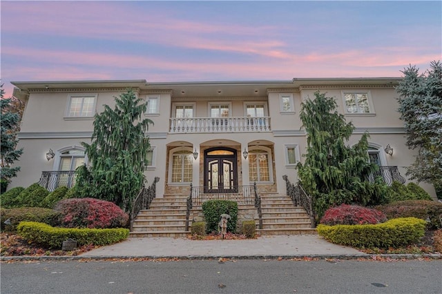 view of front of home featuring a balcony and a porch