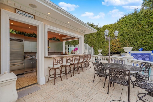 view of patio with outdoor dry bar