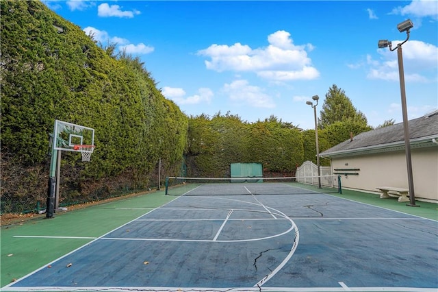 view of sport court featuring tennis court