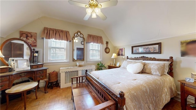 bedroom featuring lofted ceiling, radiator, ceiling fan, and parquet flooring