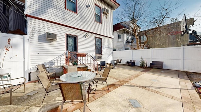 view of patio featuring a fenced backyard and outdoor dining area