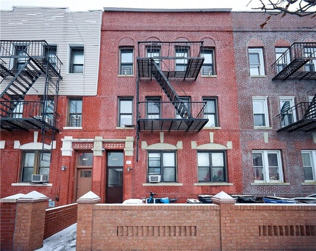 view of building exterior with cooling unit