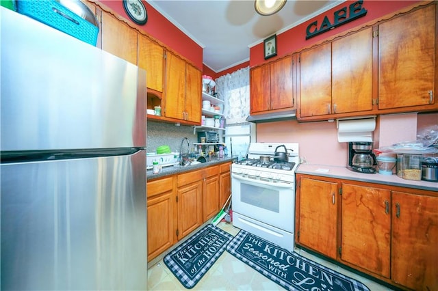 1830 81st St, Brooklyn, NY 11214 - kitchen with ornamental molding, white gas stove, freestanding refrigerator, open shelves, and brown cabinetry