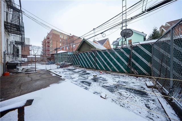 view of yard layered in snow