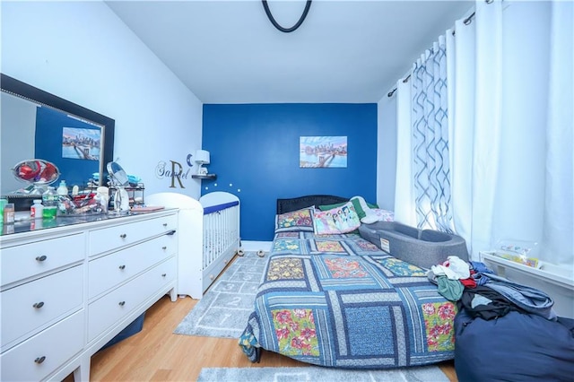 bedroom with light hardwood / wood-style flooring