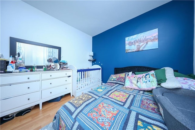 bedroom with light hardwood / wood-style flooring