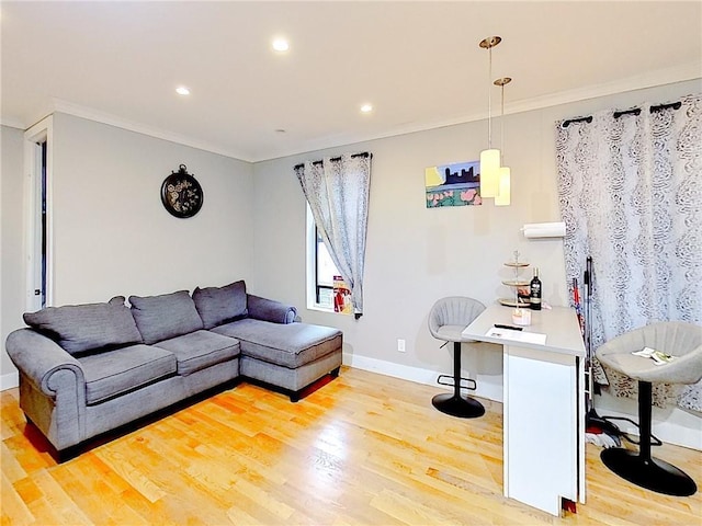 living room with ornamental molding and light hardwood / wood-style floors