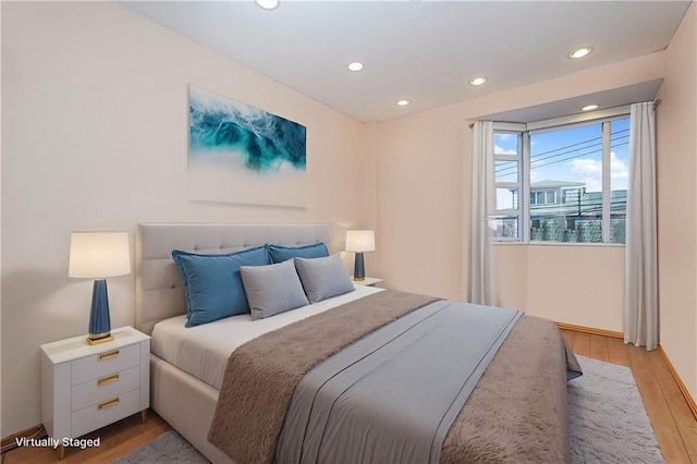 bedroom with light wood-type flooring