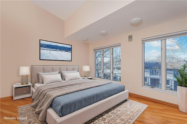 bedroom with hardwood / wood-style floors