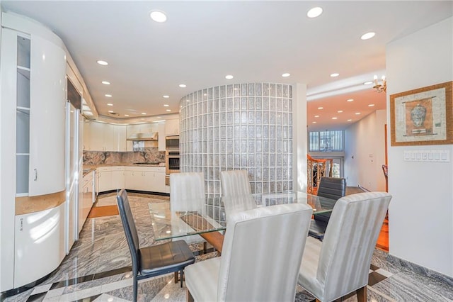 dining space featuring an inviting chandelier