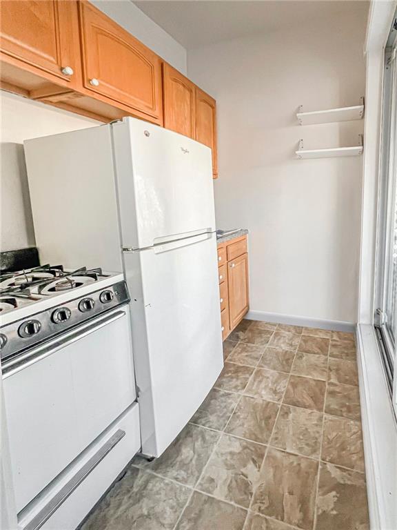 kitchen with white gas range