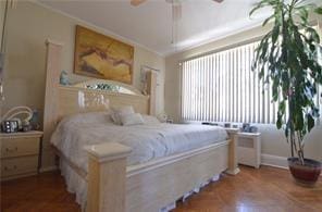 bedroom featuring a ceiling fan and crown molding