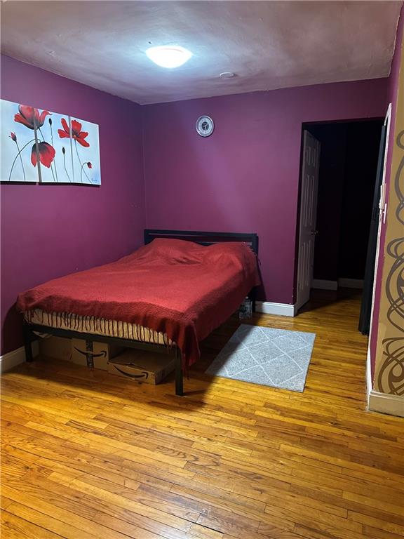 bedroom featuring hardwood / wood-style floors