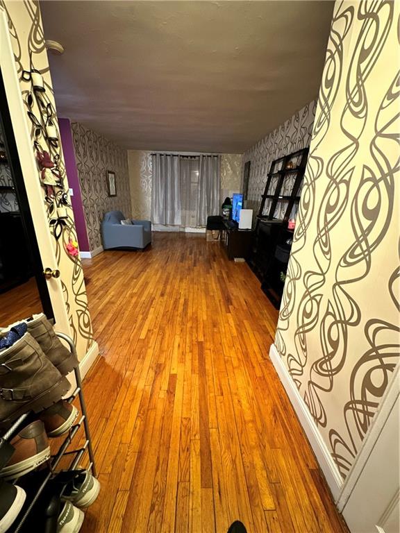 unfurnished living room featuring hardwood / wood-style flooring