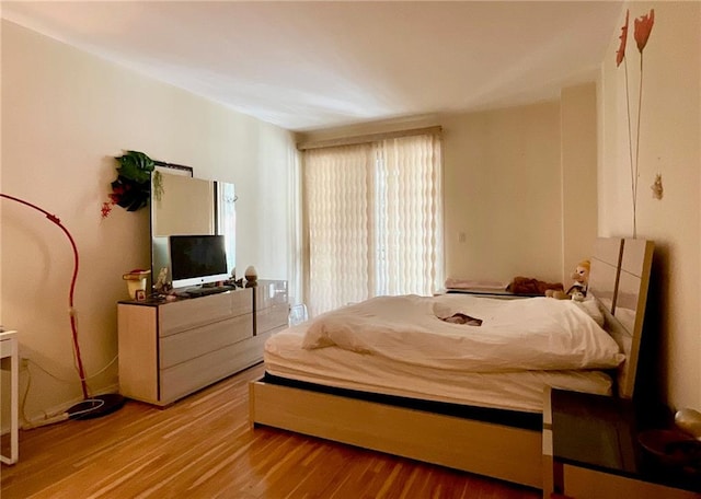 bedroom with light hardwood / wood-style floors