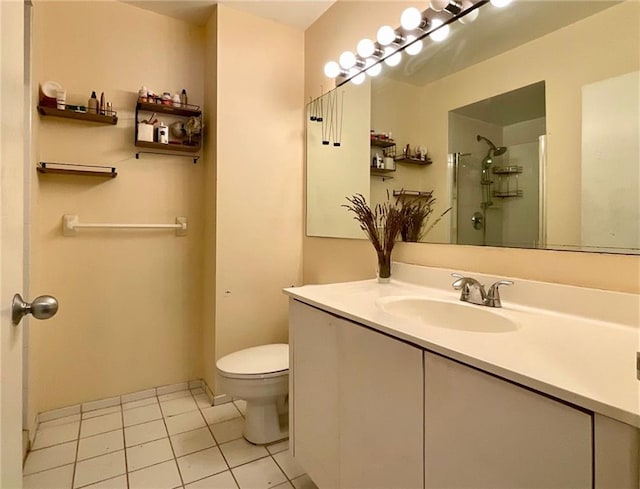 bathroom featuring toilet, walk in shower, tile patterned floors, and vanity