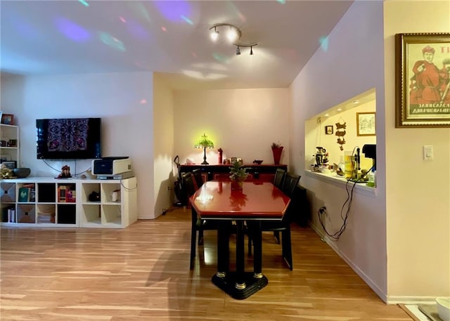 dining area with light hardwood / wood-style floors